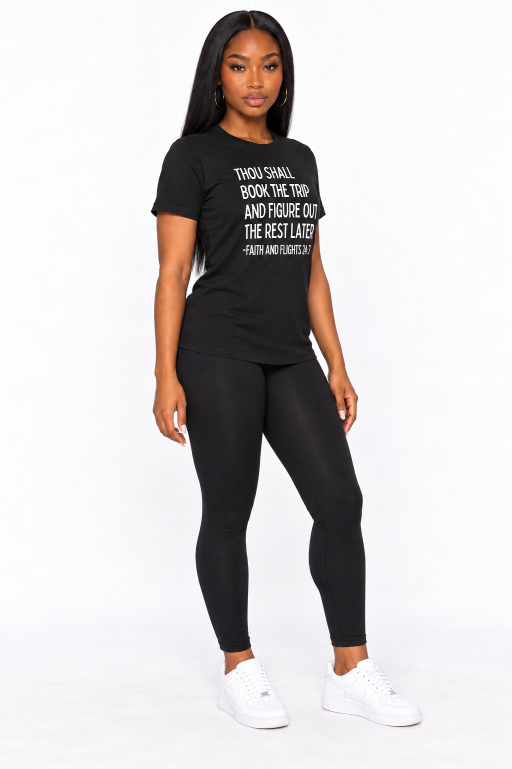 AI styling mockup: Arielle in black Faith and Flights white-print tee with leggings, angled view