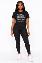 AI styling mockup: Arielle in black Faith and Flights white-print tee with black leggings, front view