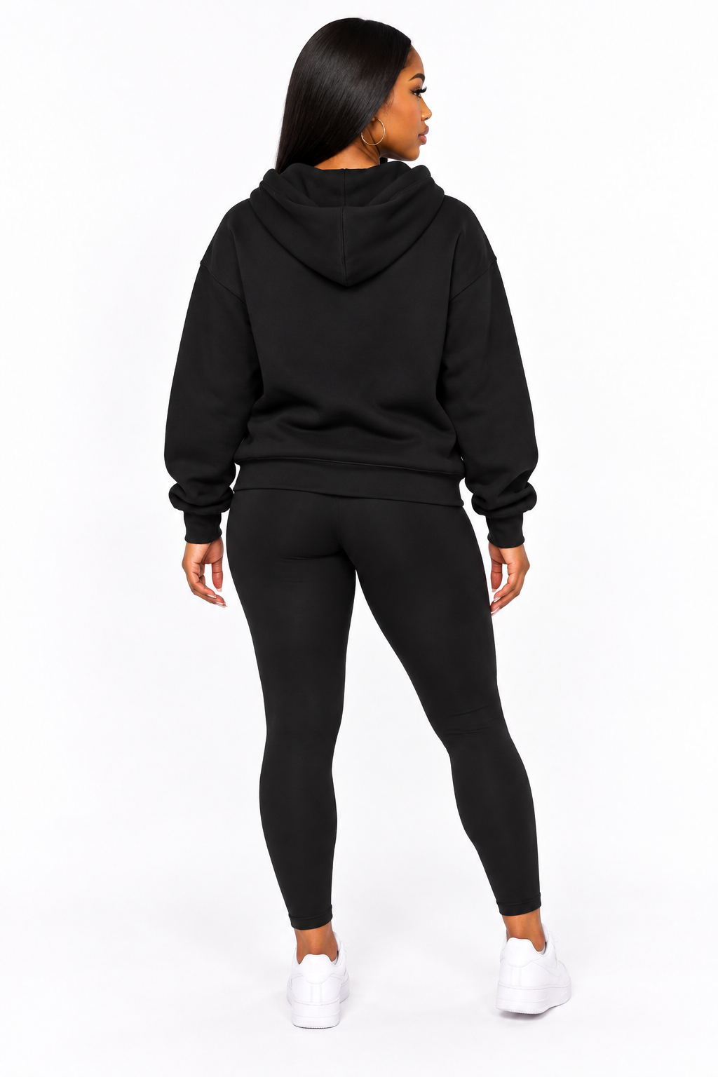 AI styling mockup: Arielle in black Faith and Flights hoodie with leggings, back view