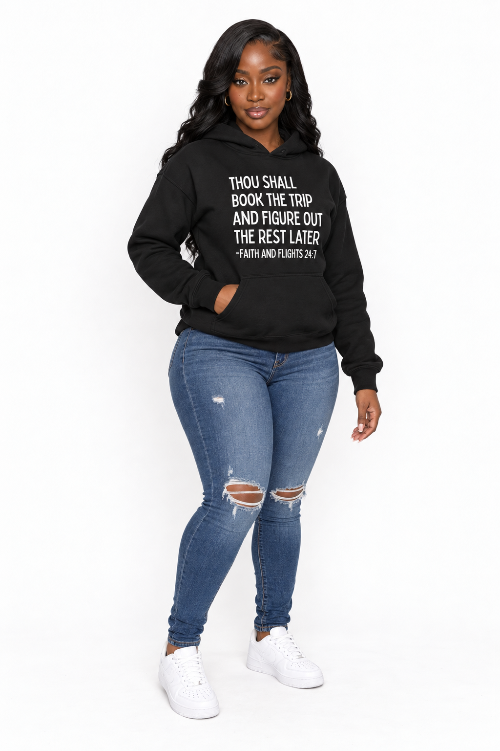 AI styling mockup: Khadijah in black Faith and Flights hoodie with distressed jeans, angled view