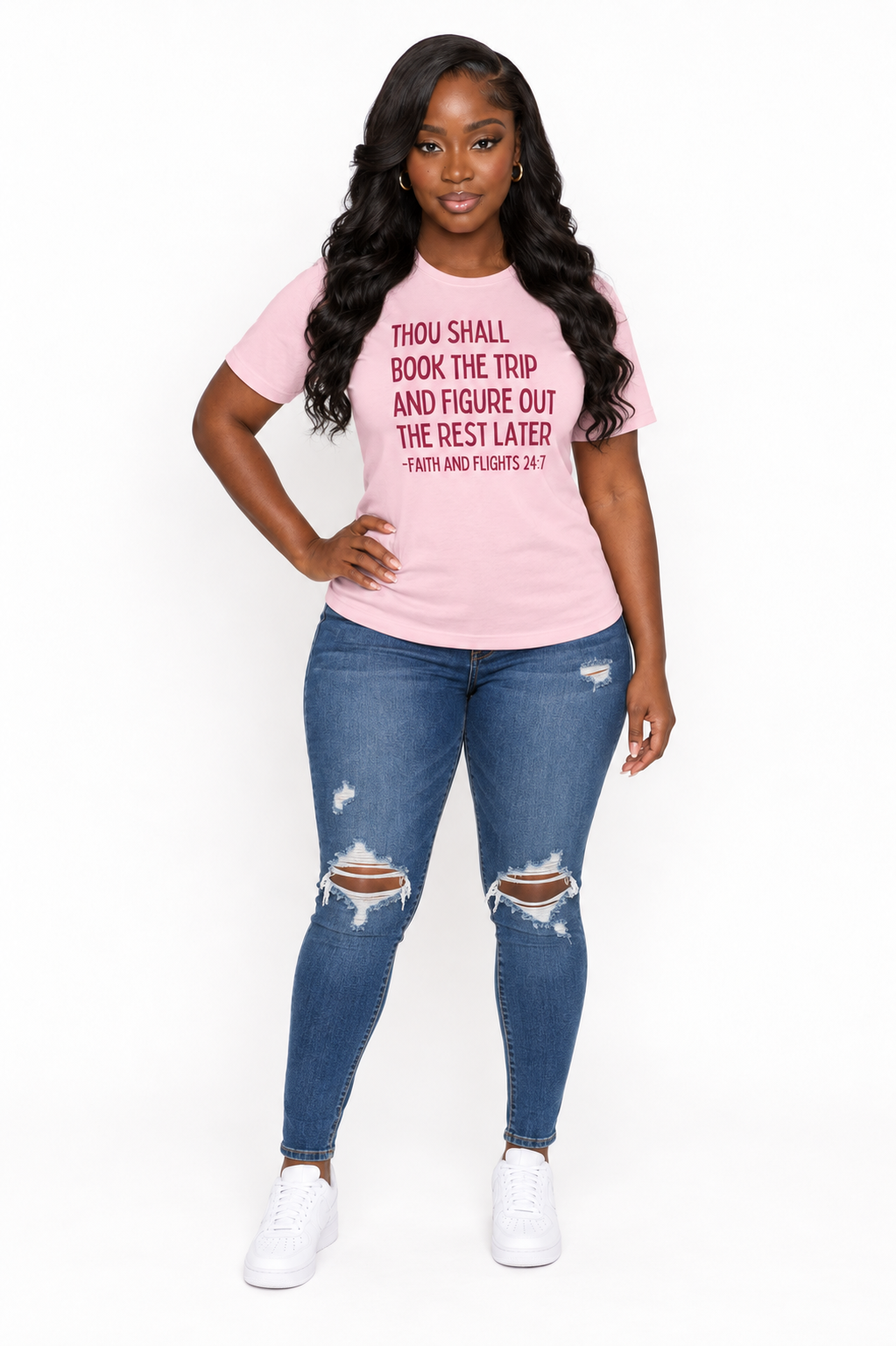 AI styling mockup: Khadijah in soft pink Faith and Flights burgundy-print tee with distressed jeans, front view