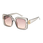 Clear sunglasses — close-up of frame, lenses and jeweled temple